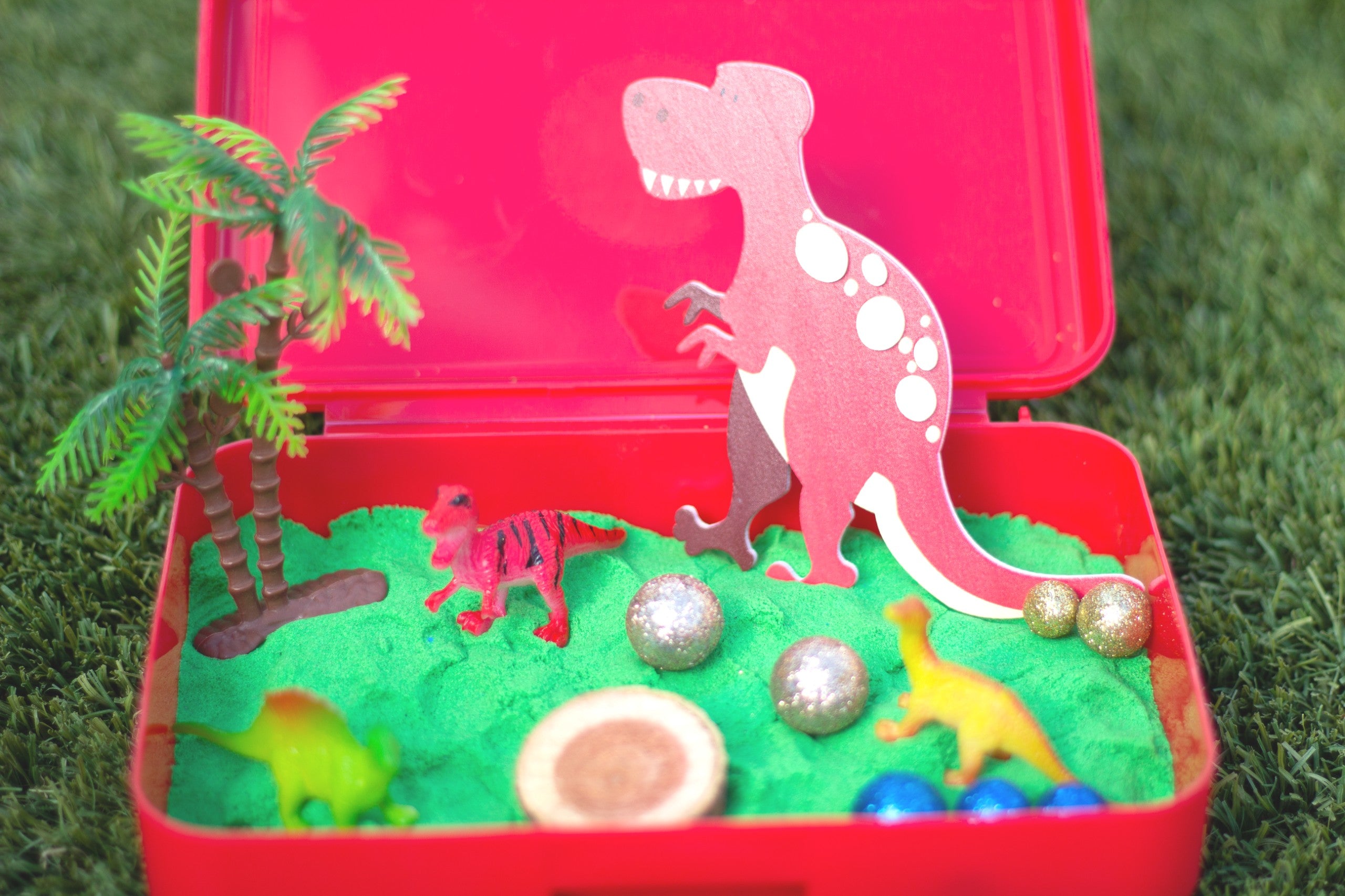 Dinosaur Sensory Bin featuring sensory sand- Perfect for kids aged 3-8